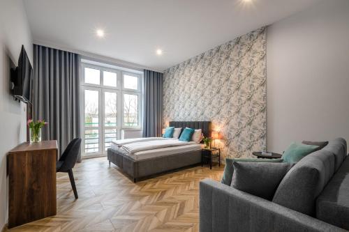 Ένα ή περισσότερα κρεβάτια σε δωμάτιο στο EASY RENT Piłsudskiego 6