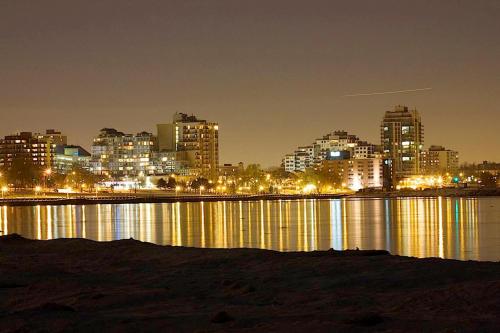 a view of a city at night with lights at Waterfront Hotel Downtown Burlington in Burlington
