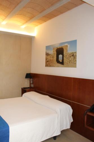 Ένα ή περισσότερα κρεβάτια σε δωμάτιο στο HOTEL ISLA PLANA