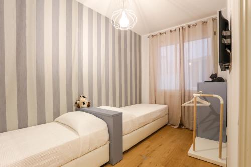 Postel nebo postele na pokoji v ubytování Treviso City Town 1