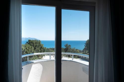 a view of the ocean from a window at X Life Hotel Sarıgerme 15 - Adult Hotel in Sarigerme