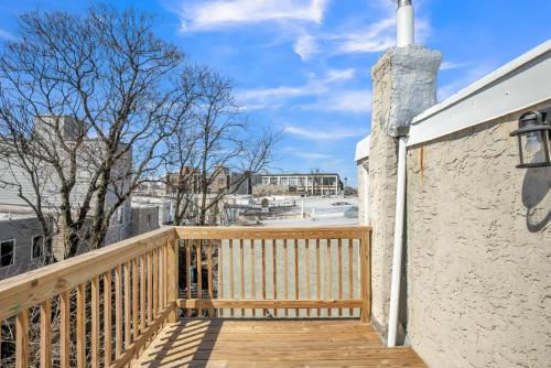 a wooden balcony with a wooden walkway next to a building at Enjoy Your Stay in this Amazing Location in Philadelphia! home in Philadelphia