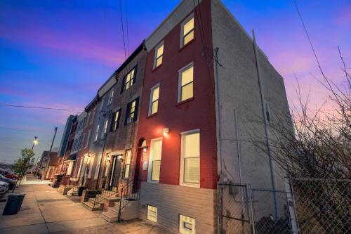 a brick building with lights on the side of it at Enjoy Your Stay in this Amazing Location in Philadelphia! home in Philadelphia