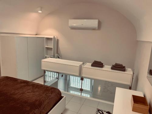a hospital room with a bed and a sink at Studio loft 85 in Torre Annunziata