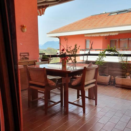 a wooden table and chairs on a patio at GUFO VERDE in Sulmona