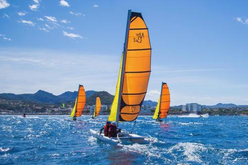 a group of people on a small sail boat in the water at Maisonnette au calme et proche mer in Mandelieu-la-Napoule