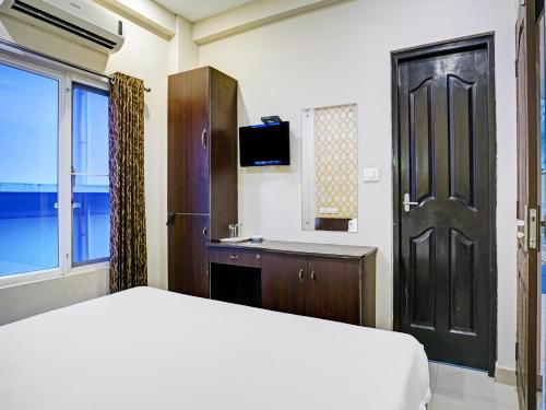 Ένα ή περισσότερα κρεβάτια σε δωμάτιο στο Galaxy Inn