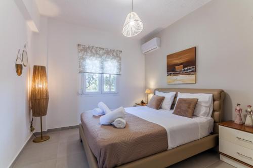 Ένα ή περισσότερα κρεβάτια σε δωμάτιο στο Gouves Living