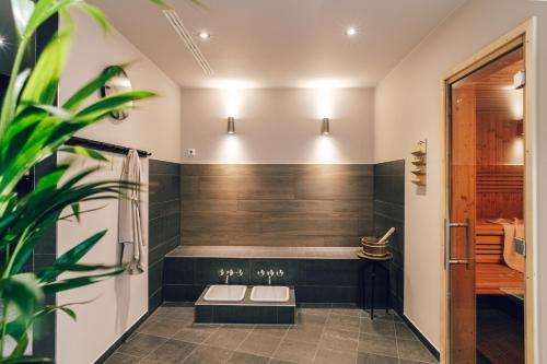 a bathroom with a shower and a toilet in it at Townhouse Leipzig in Leipzig