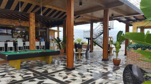 a pool table in the middle of a patio at Jack Kandi Grosvenor Square in Angeles