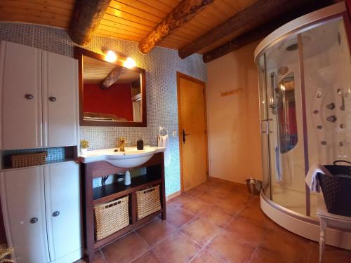 a bathroom with a sink and a shower at Cal Calçó in Pinós