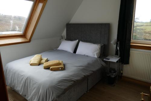 מיטה או מיטות בחדר ב-Wallace Lodge