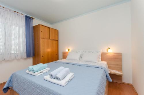 Postel nebo postele na pokoji v ubytování Apartments Mijatovic