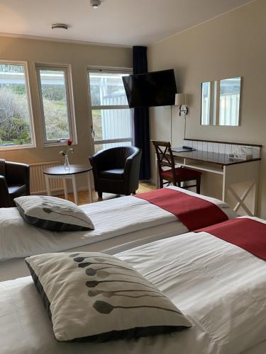 Postel nebo postele na pokoji v ubytování Nordby Hotell