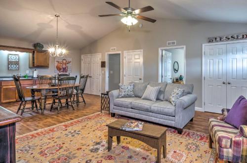 a living room with a couch and a table at Pet-Friendly Brownsville Retreat with Porch! in Sloans Crossing