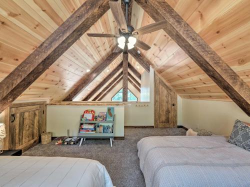 a bedroom with two beds and a ceiling fan at Luxury Retreat Custom Mi-Wuk Village Cabin! in Mi-Wuk Village