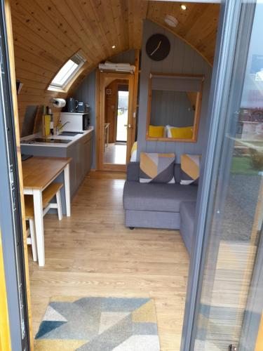a living room and kitchen of a tiny house at North Star Glamping in Lybster