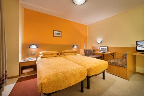 מיטה או מיטות בחדר ב-Garni Oasi
