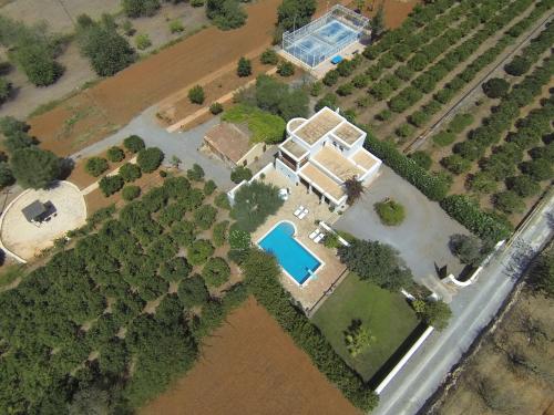 an aerial view of a house with a swimming pool at Can Gat in Sant Carles de Peralta