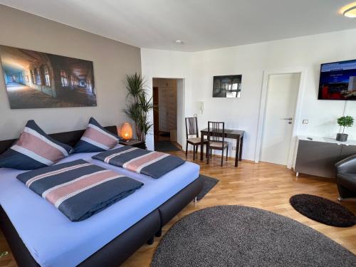 Ένα ή περισσότερα κρεβάτια σε δωμάτιο στο Pension-Leipzig-Süd