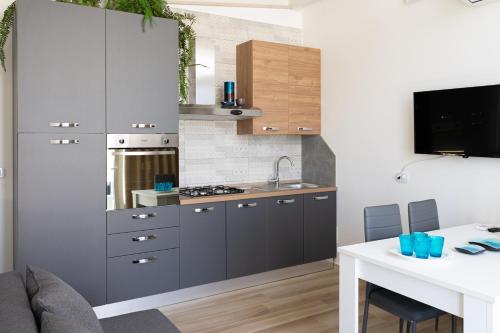 Kuchyň nebo kuchyňský kout v ubytování Antonio Busco rooms