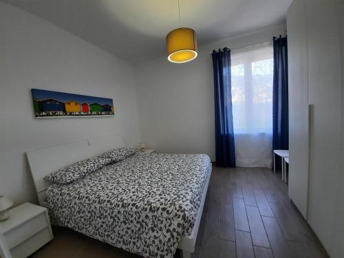Säng eller sängar i ett rum på Appartamento Tramontana
