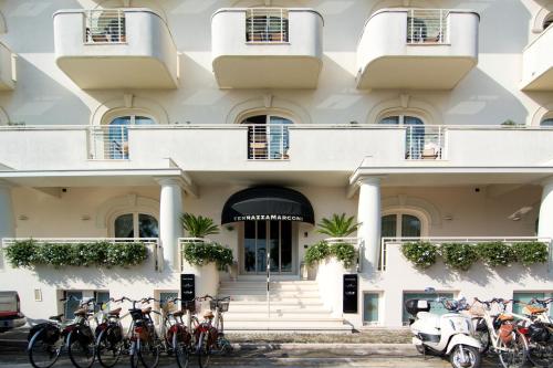 a building with bikes parked in front of it at Terrazza Marconi Hotel&Spamarine in Senigallia