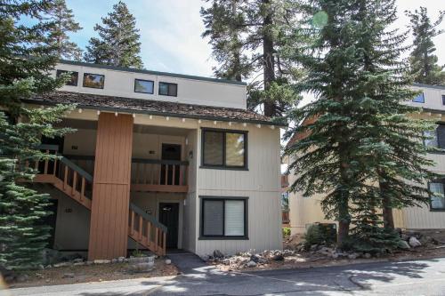 a large house with trees in front of it at Discover 4 in Mammoth Lakes