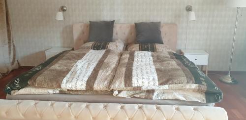 מיטה או מיטות בחדר ב-Weser-Koje