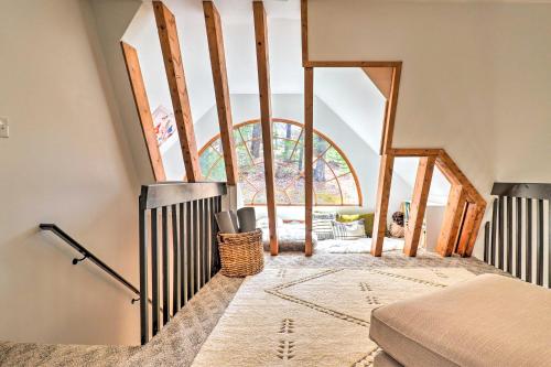 a room with a staircase with a window at Amazing A-Frame with Private Hiking and Amenities in Brevard