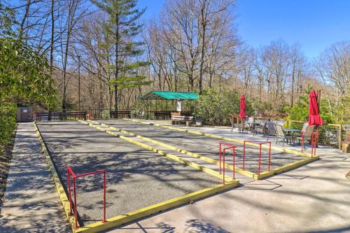 a group of tables and chairs in a park at Amazing A-Frame with Private Hiking and Amenities in Brevard