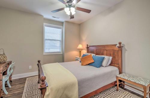 a bedroom with a bed with a ceiling fan at Updated Apt 1 Mi to Western Kentucky University! in Bowling Green
