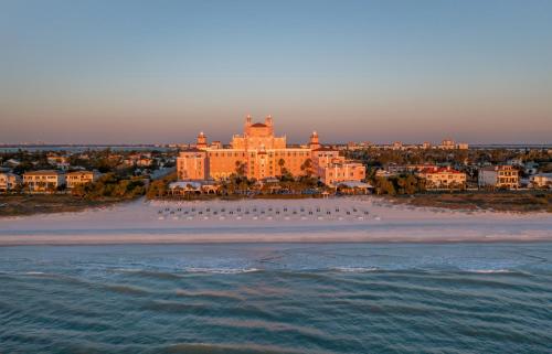 a large building on the beach in front of the water at The Don CeSar in St Pete Beach