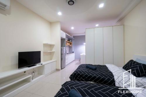 a bedroom with a bed and a flat screen tv at 9am-5pm, SAME DAY CHECK IN AND CHECK OUT, Work From Home, Shaftsbury-Cyberjaya, Comfy Home by Flexihome-MY in Cyberjaya