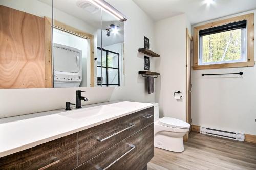 a bathroom with a sink and a toilet at Sutton Wellness cabin #267 Rez-de-chaussée in Sutton