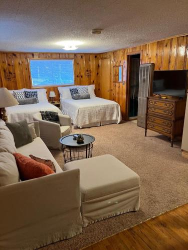 a living room with two beds and a couch at Mountain View Lodge in Red River