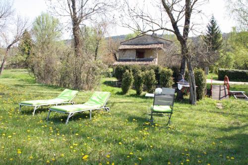 a group of chairs sitting in the grass at Touroulet in Suze