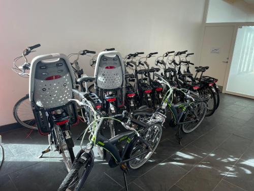 a bunch of bikes parked in a room at Perle Øer Maritime ferieby Ebeltoft in Ebeltoft