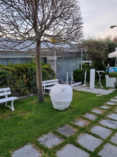 a park with a tree and a bench and a tree at B&B Laura in Terzigno