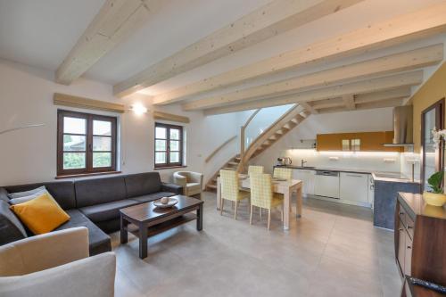 a living room with a couch and a table at Apartmány Na Seníku in Třeboň