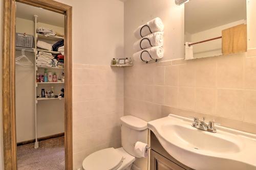 a bathroom with a toilet and a sink at Cozy Allentown Home, 2 Mi to Hamilton District! in Allentown