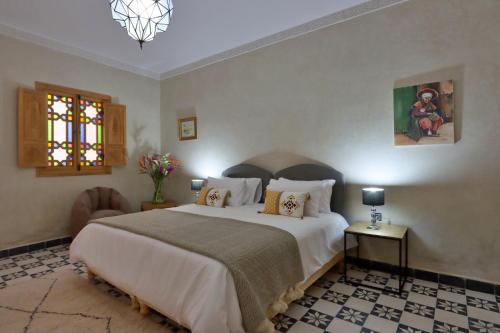 Postel nebo postele na pokoji v ubytování Riad Banatti