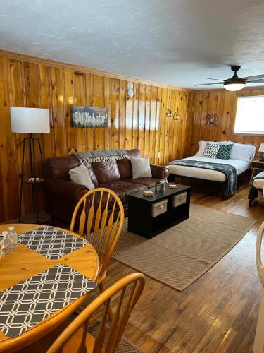 a living room with a couch and a table at Mountain View Lodge in Red River