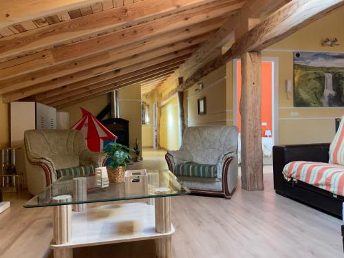 a living room with couches and a glass table at Casa Aurora in Francos