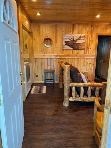 a room with a bed in a log cabin at Mountain View Lodge in Red River