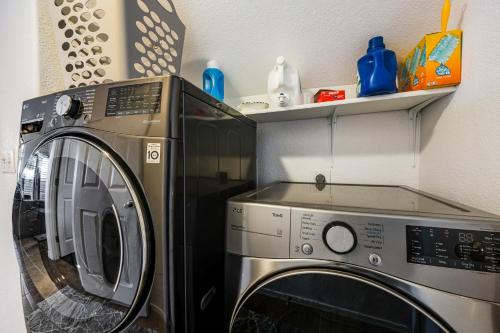 a washer and dryer sitting next to each other at Aspen Adventure in Avondale