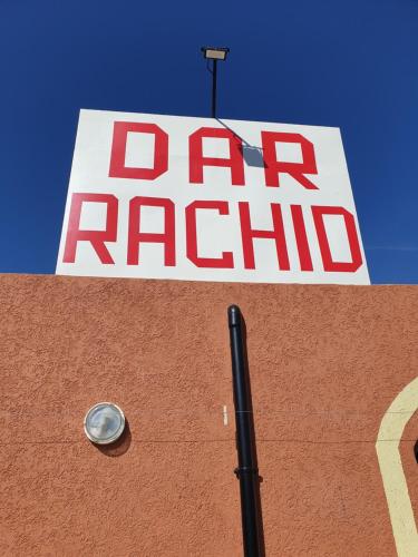 a sign on the side of a car dealership at Dar rachid ouzoud in Azilal