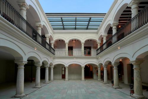 an empty hallway of a building with a balcony at Casa Quiote Hotel Boutique City Center based - Adults Only in Oaxaca City