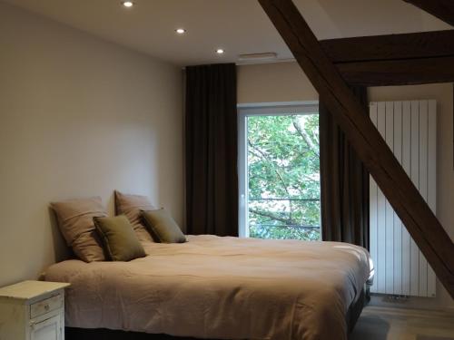 Postel nebo postele na pokoji v ubytování B&B Les Tilleuls