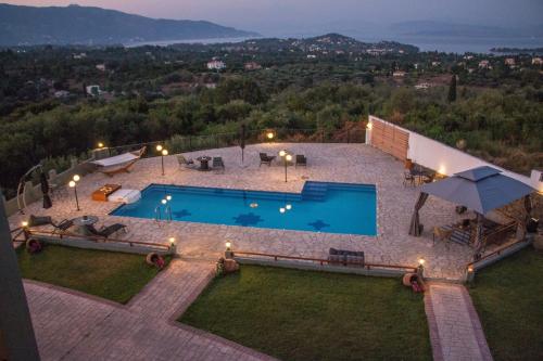 an overhead view of a swimming pool in a backyard at Heaven Hill Villas ground floor in Gouvia